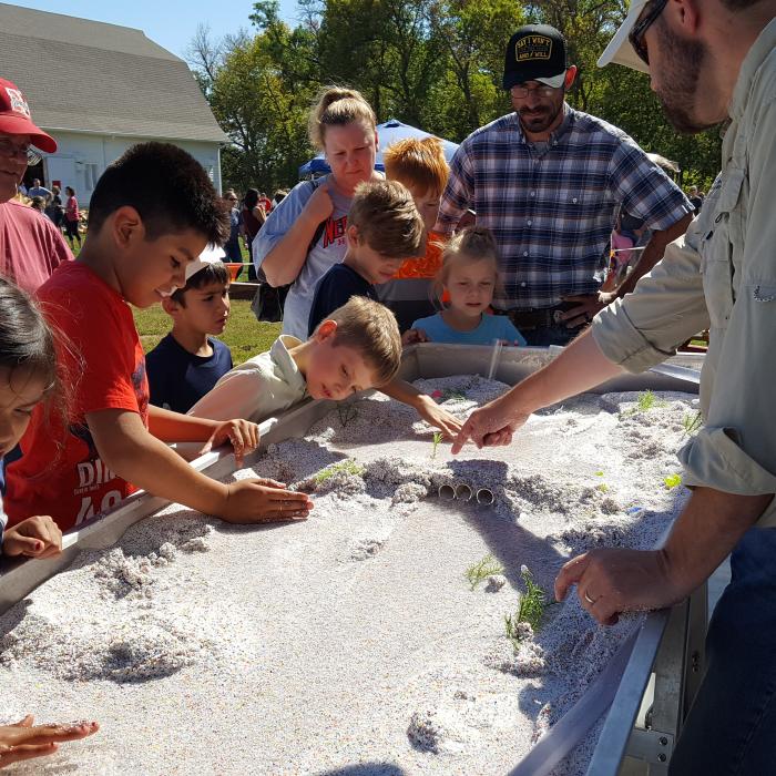 Children play in the sand with the Platte River Recovery Implementation Program on October 2, 2016.