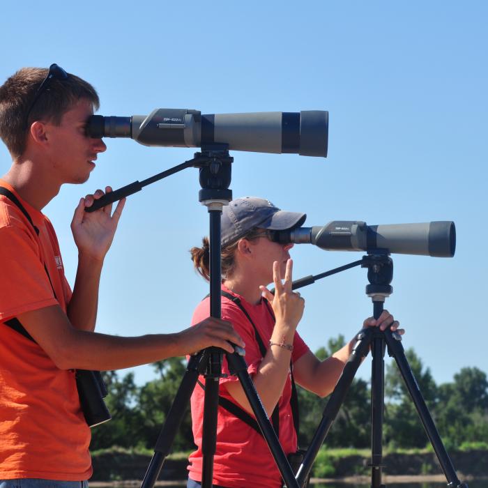 Platte River birders looking through spotting scopes