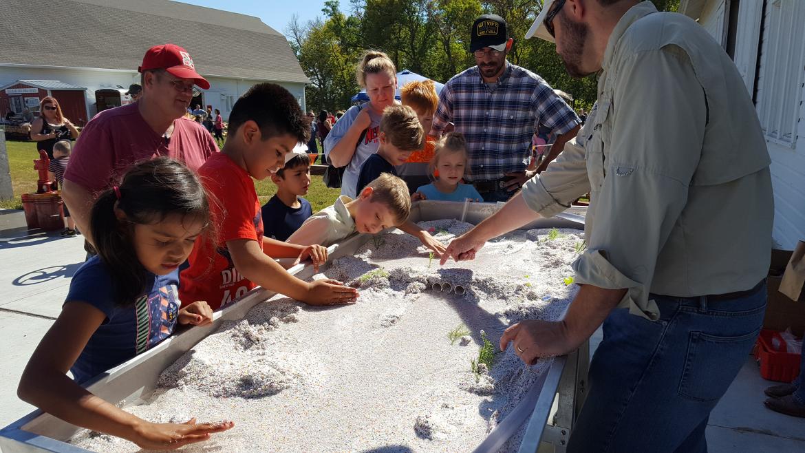 Children play in the sand with the Platte River Recovery Implementation Program on October 2, 2016.