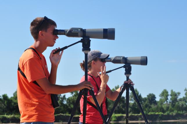 Platte River birders looking through spotting scopes